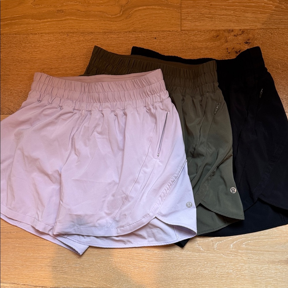 3 pair Lulu Track That High-Rise Lined Short 5" in Black, Olive, and Lavender.